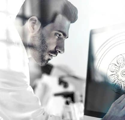 man with beard working on computer