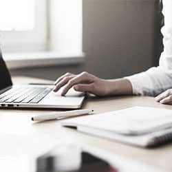 woman's hand on laptop