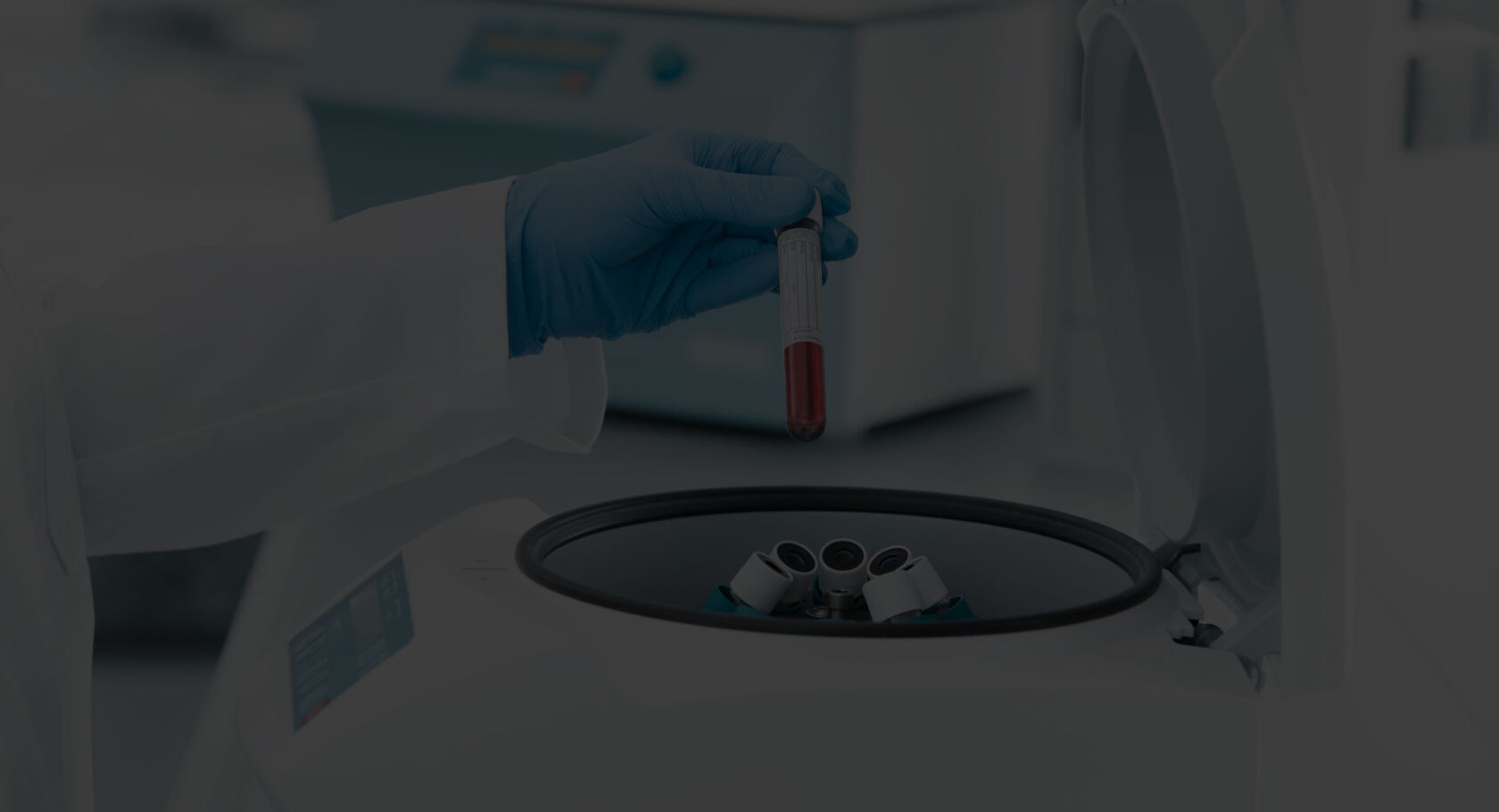 loading blood tube into Hettich small centrifuge